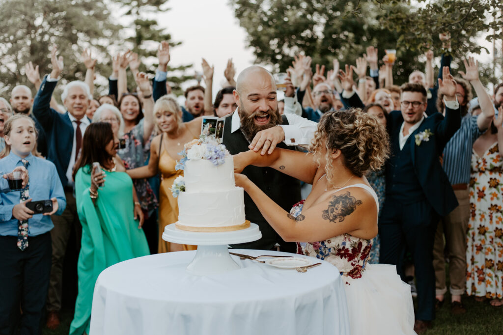 Minnesota DJ happily announced it was time to cut the cake. The Bride and Groom were celebrated by their guests. 