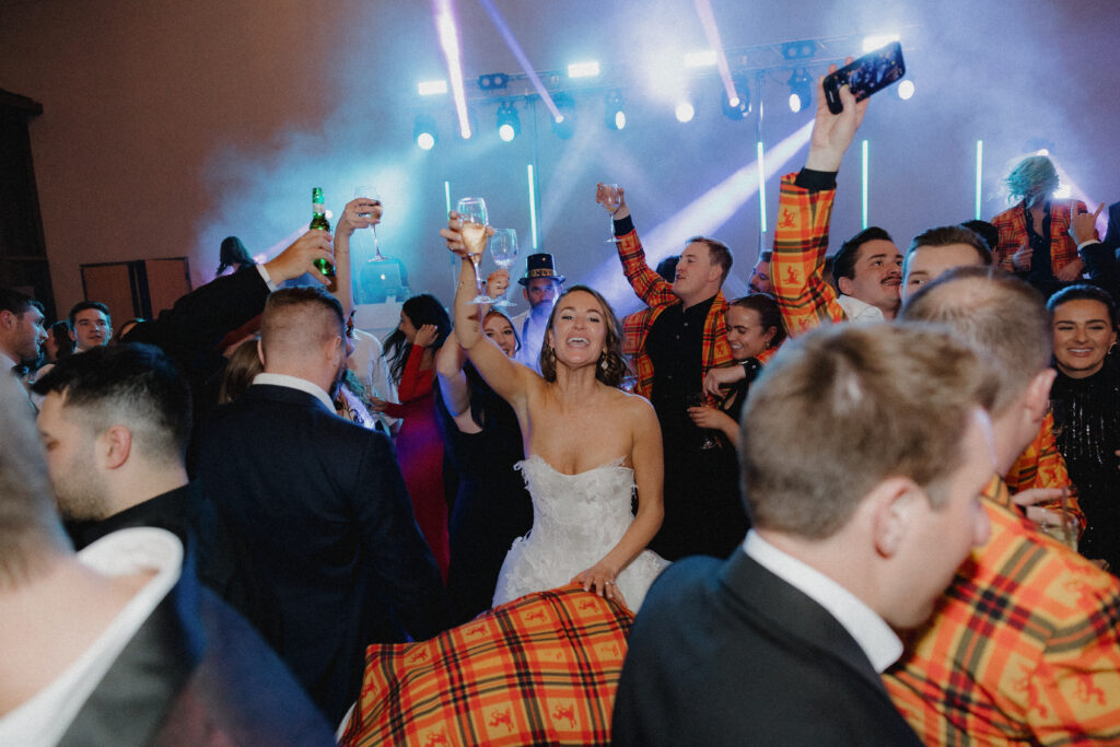 This Minneapolis, MN couple turned their wedding into a music festival with DJ MN Events EPIC around the room and stage lighting! 