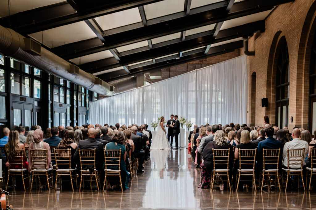 Guests enjoying a comfortable ceremony on a smokey day downtown at The Depot Minneapolis