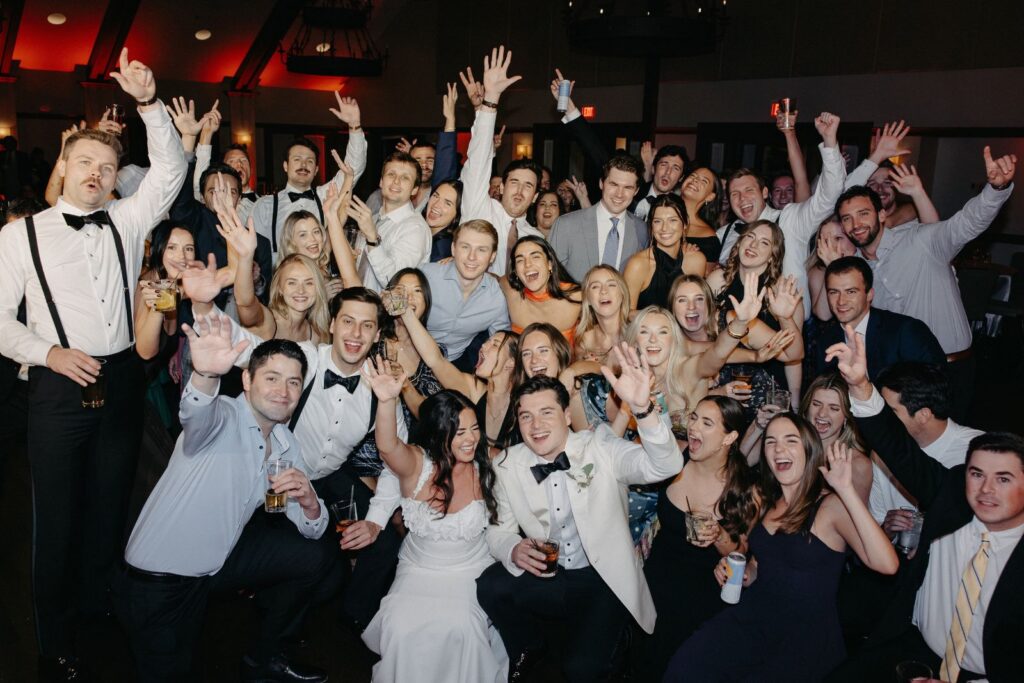 Full wedding group photo on the dance floor at Interlochen Country Club